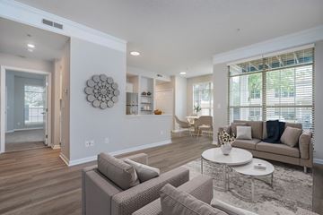 Dublin apartment for rent - A modern living room with a large couch and a coffee table.