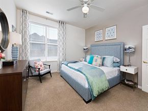 Petersburg apartment for rent - a bedroom with a bed and a ceiling fan at Addison Crater Woods, Virginia