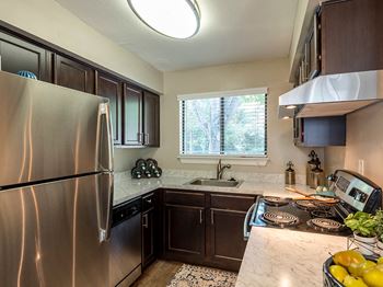 Updated kitchen at vert at six forks apartments in raleigh, nc