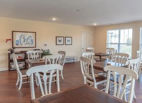 Raleigh apartment for rent - a dining room with white chairs and tables