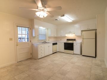 Wilmington apartment for rent - A kitchen with white cabinets and appliances.