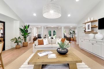 Wake Forest apartment for rent - A living room with a white couch and a wooden coffee table.