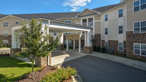 Raleigh apartment for rent - the view of the entrance to a building with a covered porch