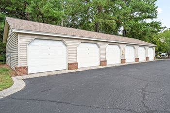 A long building with four garage doors.