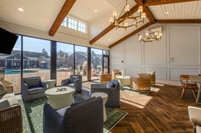 Southern Pines apartment for rent - A sunny day in a spacious room with a pool outside.