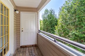 Williamsburg apartment for rent - A white door is on the porch of a house.