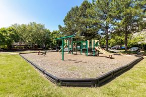 Williamsburg apartment for rent - A playground with a green slide and a black base.