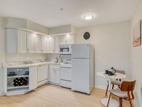 Rockville apartment for rent - A kitchen with white appliances and cabinets.