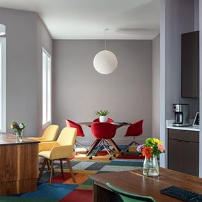 Windsor Mill apartment for rent - A modern dining room with a wooden table and chairs.