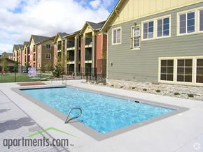 Reno apartment for rent - A swimming pool in front of apartment buildings.