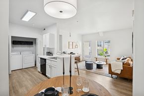 Boise apartment for rent - A modern kitchen with a dining table set for two.