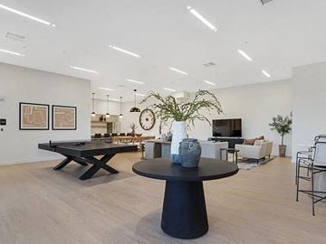 Clearfield apartment for rent - A modern living room with a black coffee table and a plant on it.