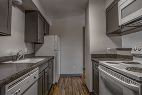 Boise apartment for rent - A kitchen with a stove, oven, and refrigerator.