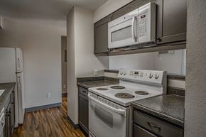Boise apartment for rent - A kitchen with a stove, oven, and microwave.