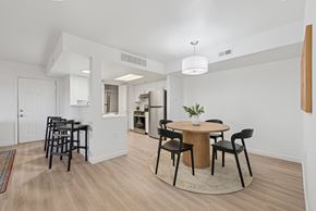 Boise apartment for rent - A dining room with a round table and chairs.