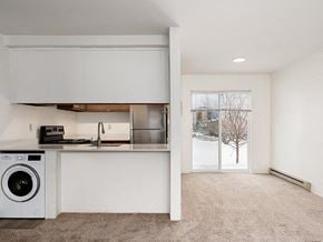 Bozeman apartment for rent - White Kitchen with a washing machine at Peaks at Ellis View, Bozeman