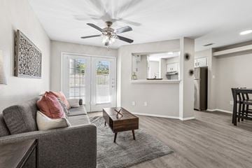 Austin apartment for rent - A living room with a grey couch and a wooden coffee table.