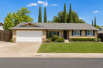 Pittsburg apartment for rent - A house with a garage and a driveway in front of it.