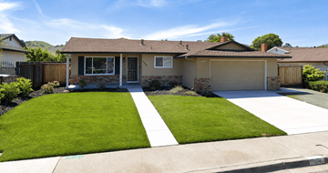 Pittsburg apartment for rent - A house with a white garage door and a black gate.