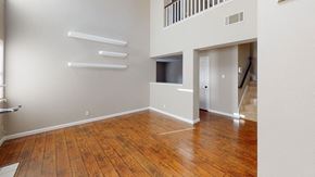Vacaville apartment for rent - A room with wooden floors and white walls.
