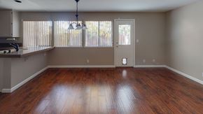 Vacaville apartment for rent - A room with wooden floors and a ceiling fan.