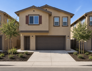 Pittsburg apartment for rent - A beige house with a brown garage door and a small window above it.