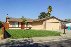 Vacaville apartment for rent - A house with a red door and a brown roof.