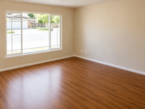 Pittsburg apartment for rent - A room with wooden flooring and a large window.