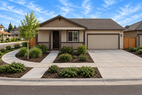 Chico apartment for rent - A house with a brown garage door and a driveway with a white border.