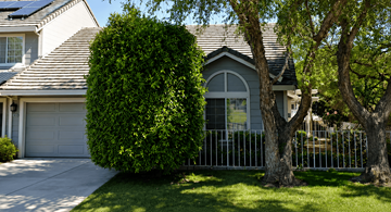 Pittsburg apartment for rent - A house with a grey roof and a grey garage door.