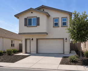 Pittsburg apartment for rent - A beige house with a white garage door and two windows.