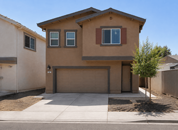 Pittsburg apartment for rent - A beige house with a brown roof and a brown garage door.