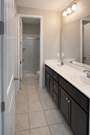 Chico apartment for rent - A bathroom with a sink, mirror, and shower.