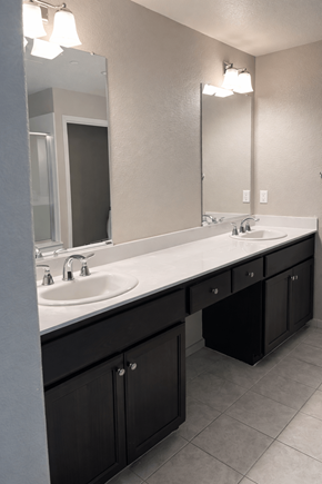 Chico apartment for rent - A bathroom with two sinks and a large mirror.