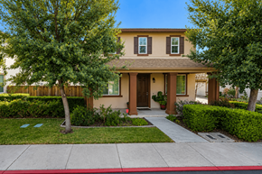Suisun City apartment for rent - A house with a brown door and a red stripe on the sidewalk.
