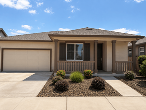 Chico apartment for rent - A house with a brown roof and a white garage door.