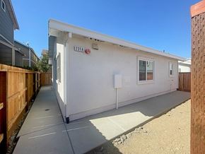 Bay Point apartment for rent - A small white building with the number 231A on it.