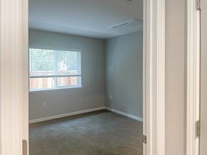 Bay Point apartment for rent - A room with a window and a carpeted floor.