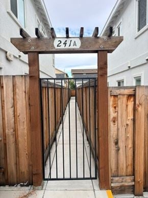 Bay Point apartment for rent - A wooden gate with the number 2411 on it.