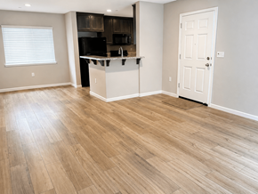 Bay Point apartment for rent - A kitchen with a white door and a wooden floor.