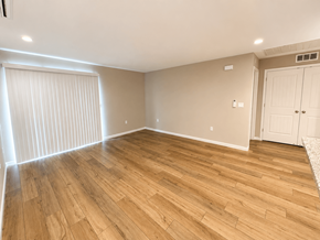 Bay Point apartment for rent - A room with wooden flooring and a white door.