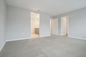Bay Point apartment for rent - A large empty room with carpeted floor and white walls.