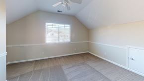 Fairfield apartment for rent - A room with a ceiling fan and a window with blinds.