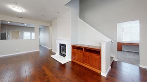 Fairfield apartment for rent - A living room with a fireplace and wooden floors.