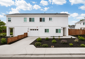 Bay Point apartment for rent - A white house with a brown fence and green plants in front.