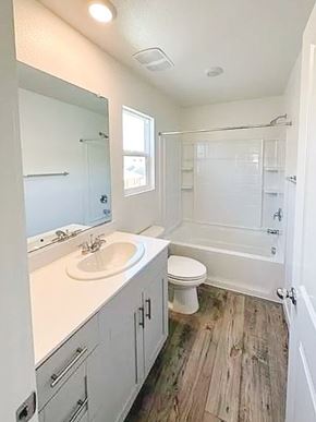 Chico apartment for rent - A white bathroom with a toilet, sink, and bathtub.