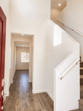 Chico apartment for rent - A hallway with a red door and a staircase.