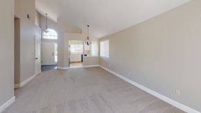Pittsburg apartment for rent - A spacious room with a carpeted floor and white walls.