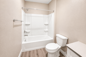Chico apartment for rent - A white toilet sits next to a bathtub in a bathroom.