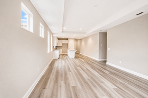 Chico apartment for rent - A long, empty room with wooden floors and white walls.